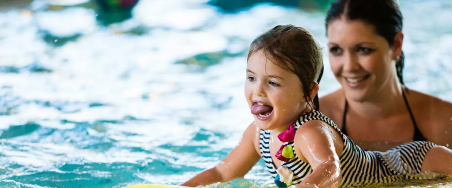 Mother and child in pool.
