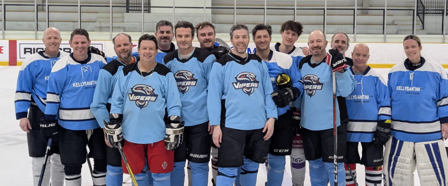 Kelly Santini Vipers hockey team standing on the ice in blue jerseys