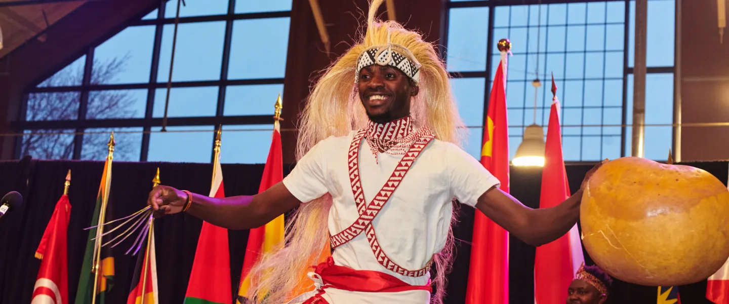 A performer from Kamengo Cultural Troupe onstage in traditional attire
