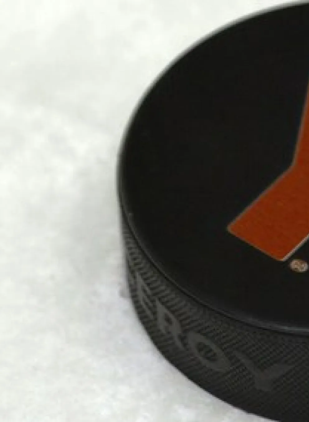 A hockey puck with the Y logo