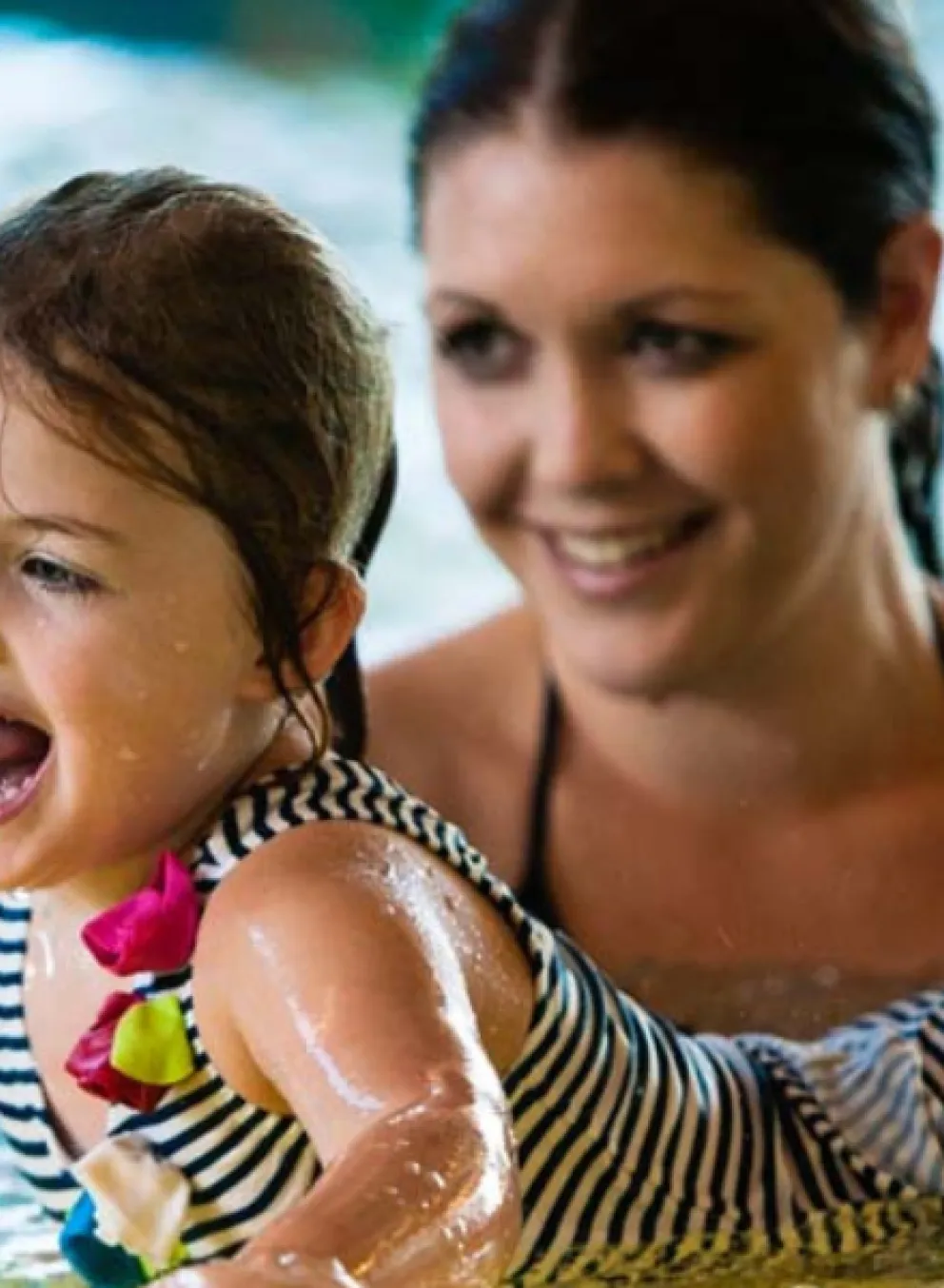 Mother and child in pool.