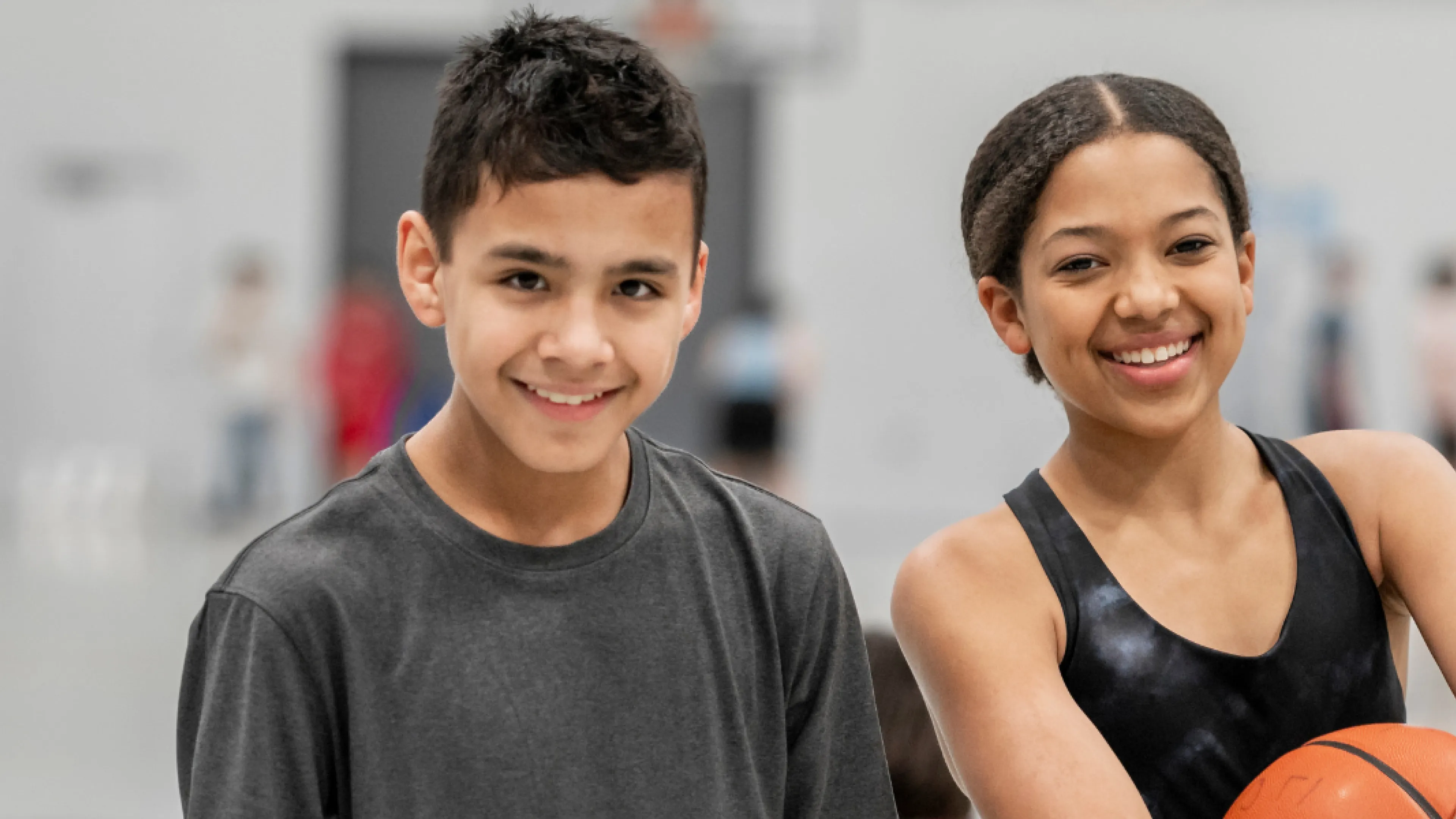 Boy and girl with basketball.
