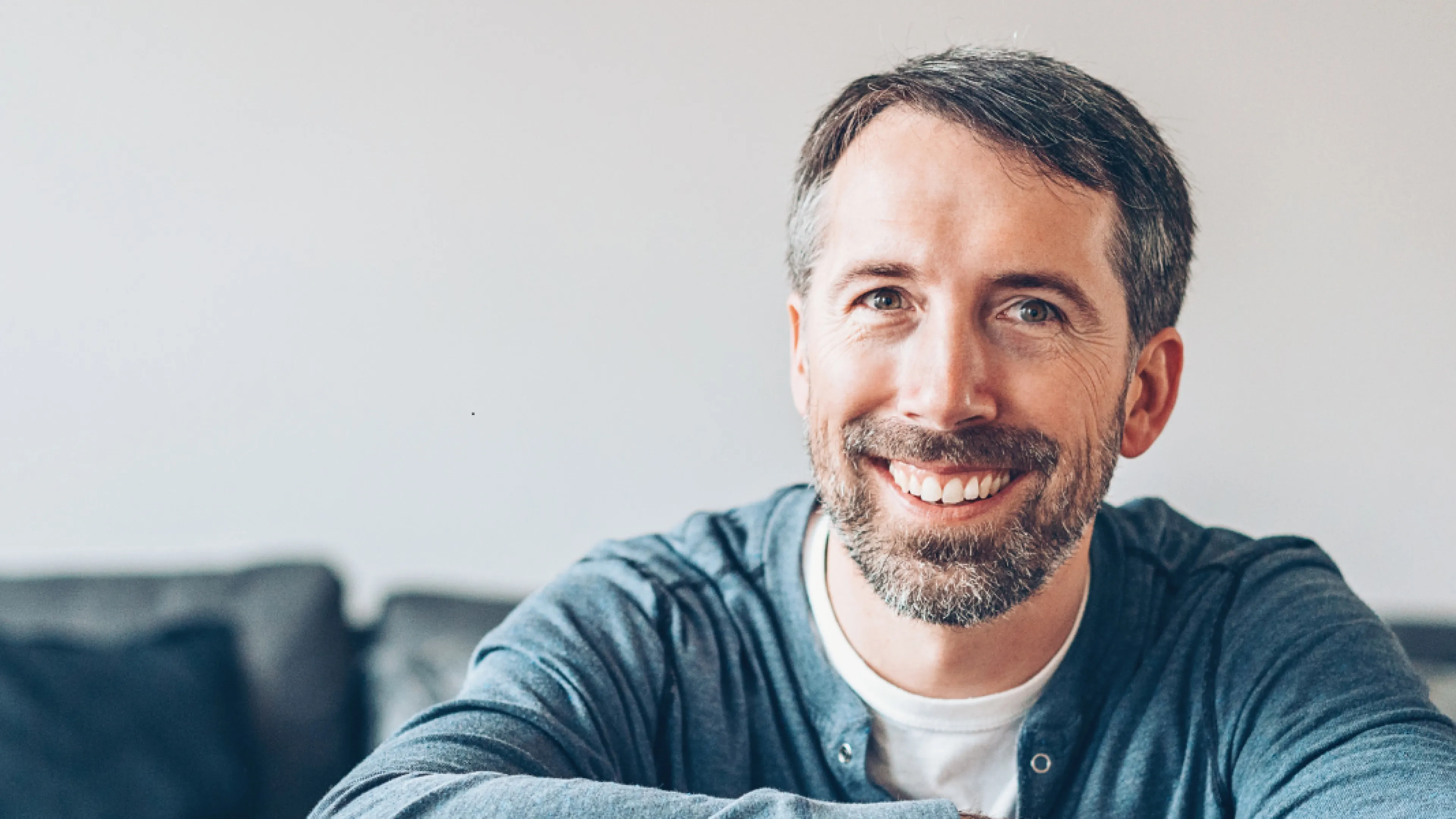 A man sitting on a couch.