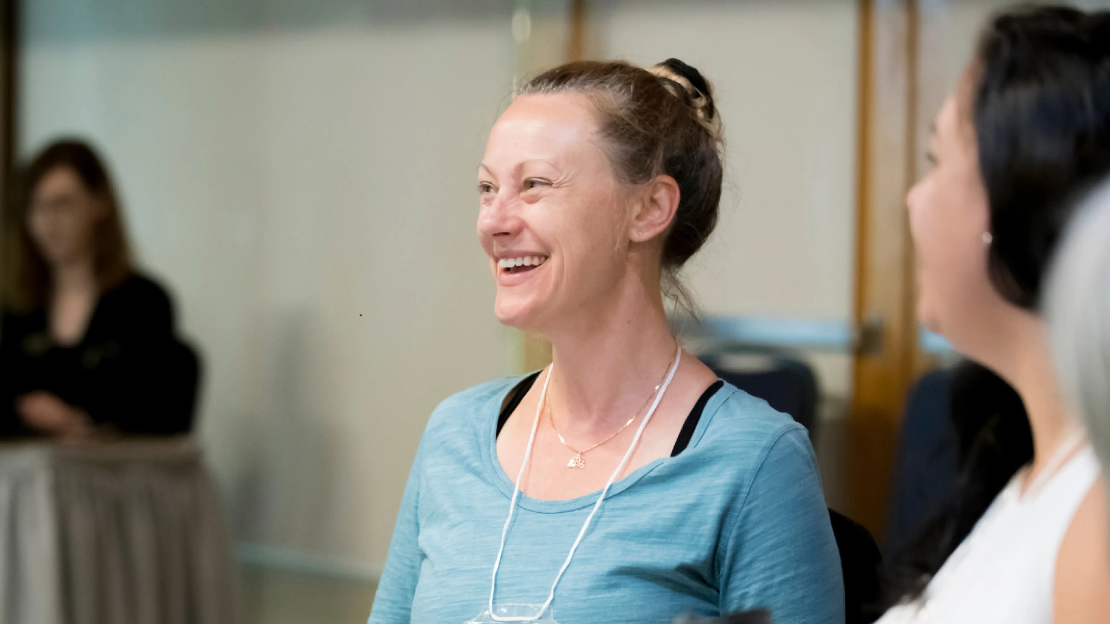 Smiling woman at a table in the Y