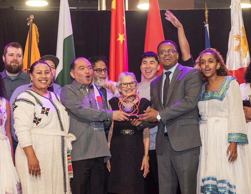Teams from Ethiopia and the Philippines accepting the Judges’ Choice award on stage at the Y Embassy Chef Showcase
