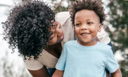 A mother and child playing.