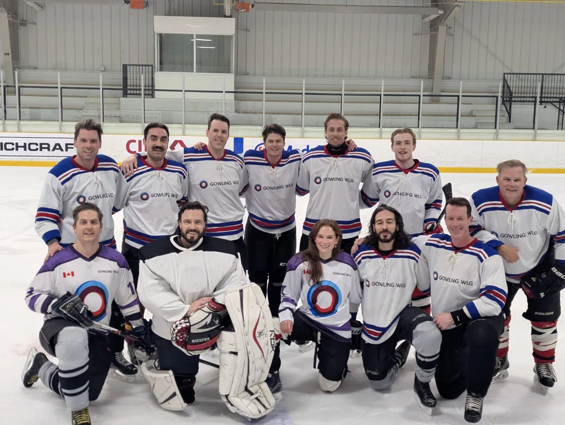 Gowling WLG hockey team posing for a group photo on the ice
