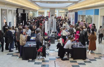 Place d'Orleans Shopping Centre atrium filled with employers booths and job seekers